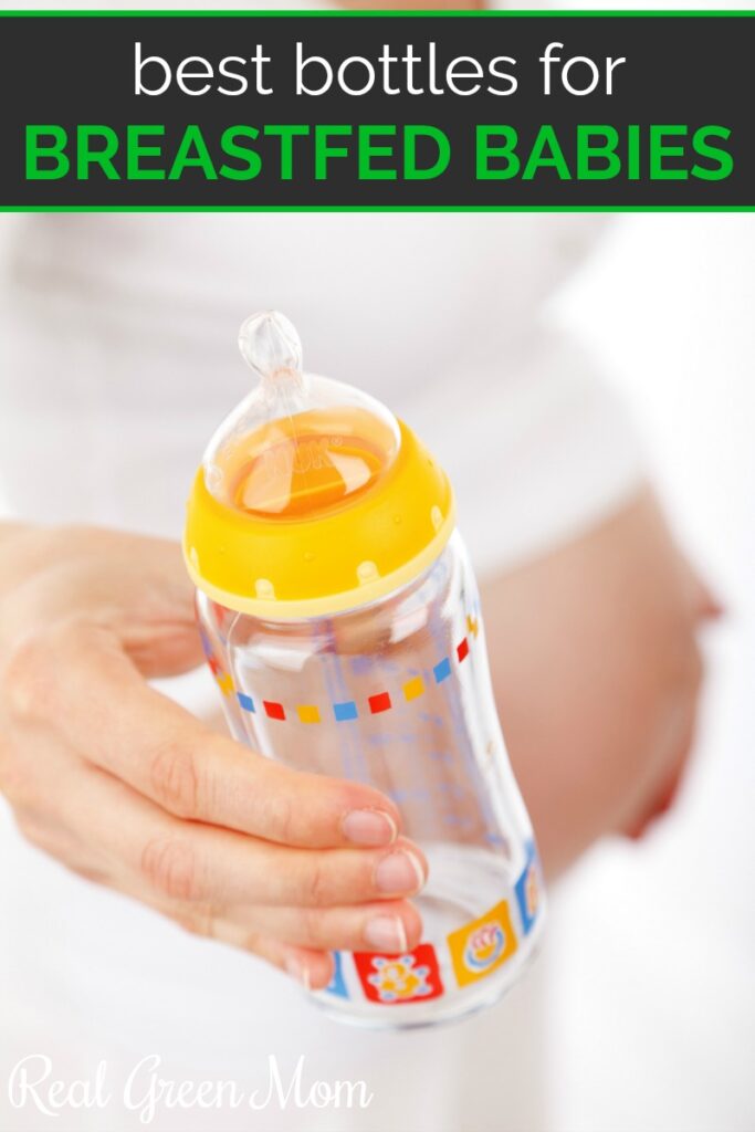 Pregnant woman wearing white and holding baby bottle