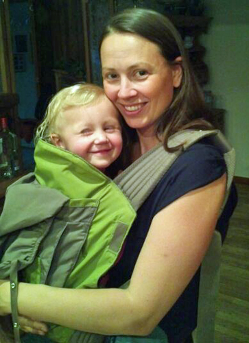 Chrystal wearing Kaylee in the Onya Baby carrier in the front carry position