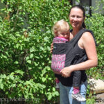 Chrystal wearing Kaylee in the front carry position in a Boba soft structured baby carrier
