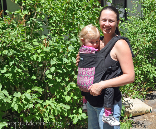 Chrystal wearing Kaylee in the front carry position in a Boba soft structured baby carrier