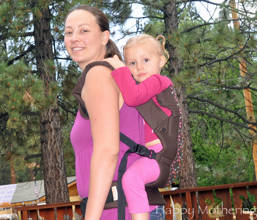 Chrystal carrying Kaylee in the back carry position with the Beco Gemini baby carrier