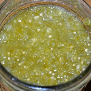 Overhead view of fermented salsa verde in a glass jar