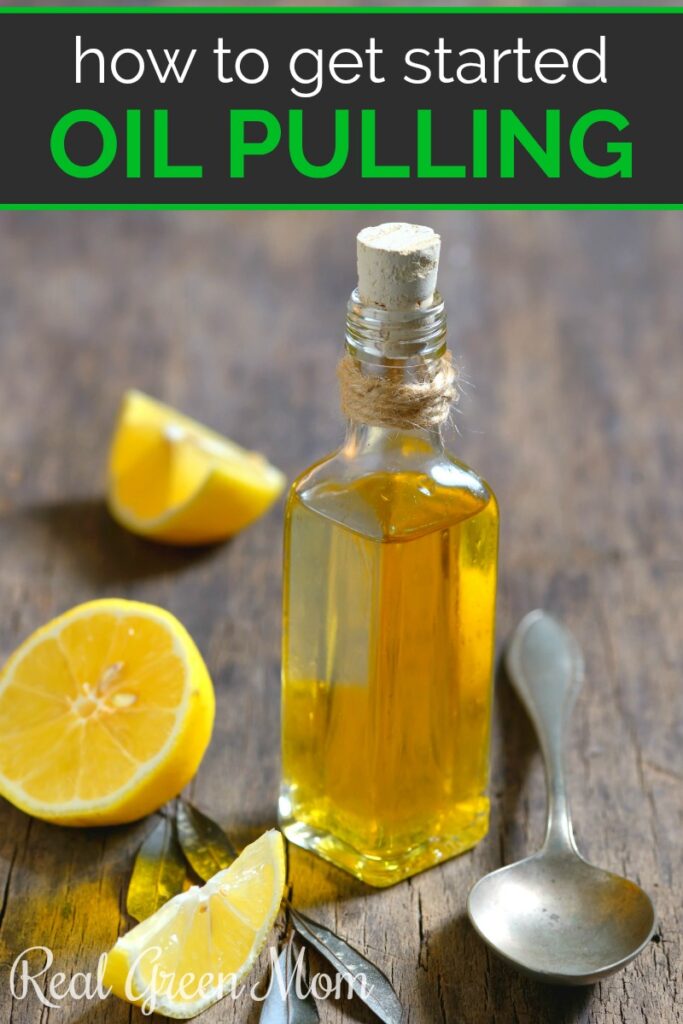 Olive oil, lemon slices and a spoon on a wood table