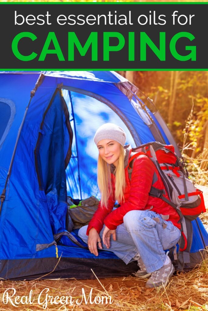 Young blond woman with red backpack in front of blue tent