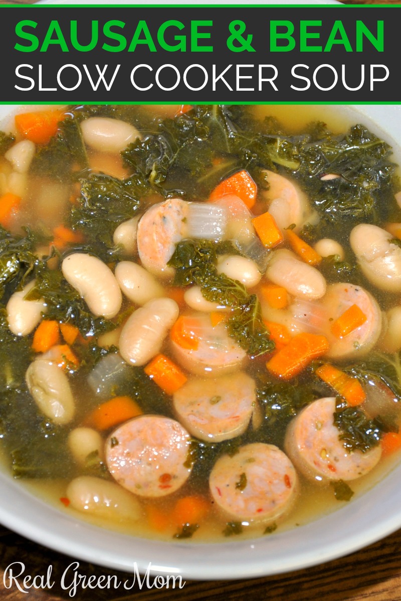 White bowl filled with homemade chicken sausage, white bean, carrot and kale soup