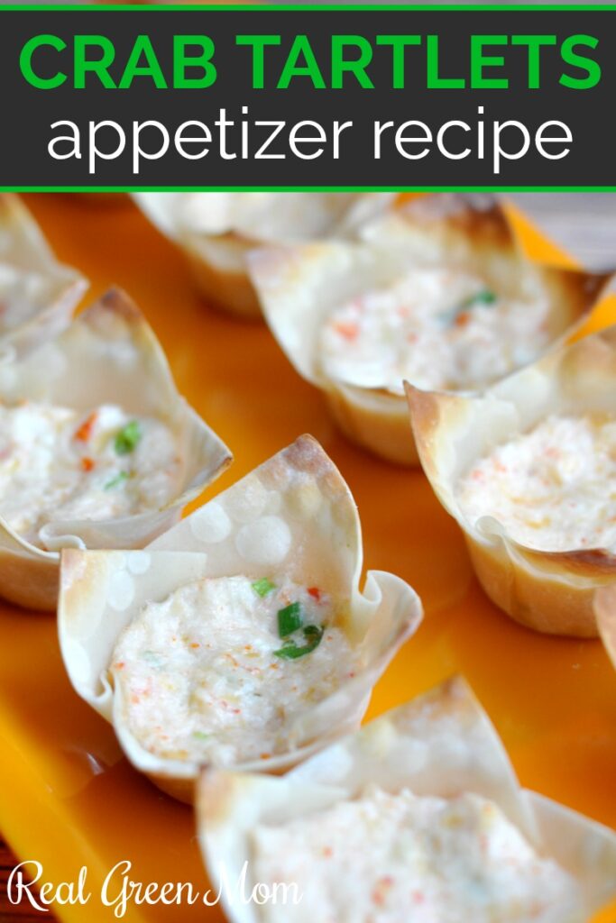 Wonton wrapper crab tartlets on an orange serving platter