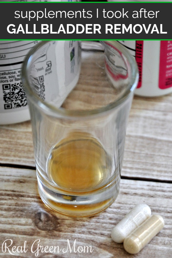 Digestive bitters in a shot glass with a probiotic and digestive enzyme supplement next to it