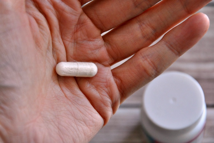 Probiotic supplement in a hand