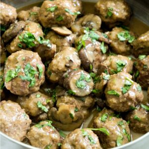 Close up of pan of Salisbury meatballs with mushrooms