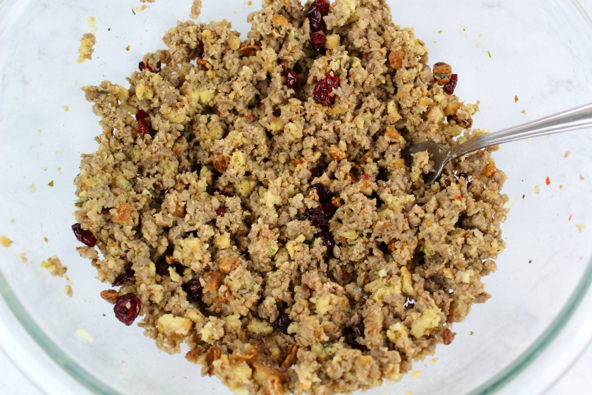 Sausage stuffing in a clear glass mixing bowl