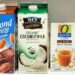 Chocolate almond milk, organic coconut milk and organic beef broth cartons on a fridge shelf